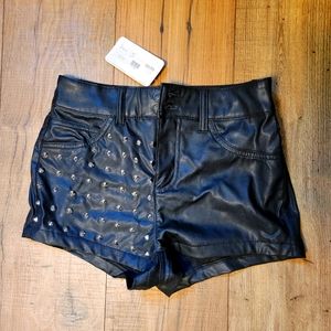 Black faux leather shorts with studs